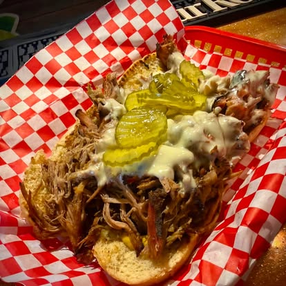smoke-brisket-sand - Oklahoma Smoke BBQ Smoked brisket sandwich in a tray with red and white checkered paper.