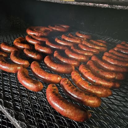 smoke-hawtdogs - Oklahoma Smoke BBQ Smoking BBQ in a smoker.