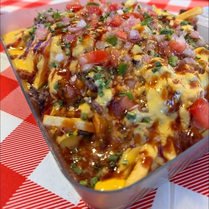 smoke-loaded-fries - Oklahoma Smoke BBQ Loaded Fries on a checkered table.
