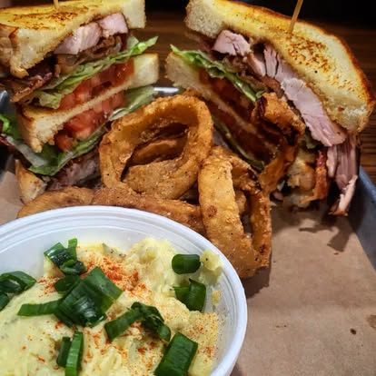 smoke-onion-rings - Oklahoma Smoke BBQ smoked bbq sandwich with onion rings and masked potato's