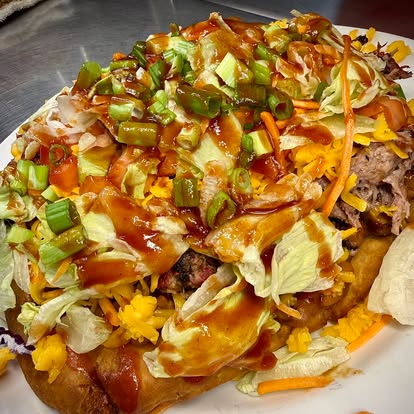 smoked-loaded-potato - Oklahoma Smoke BBQ BBQ Spud food displayed.
