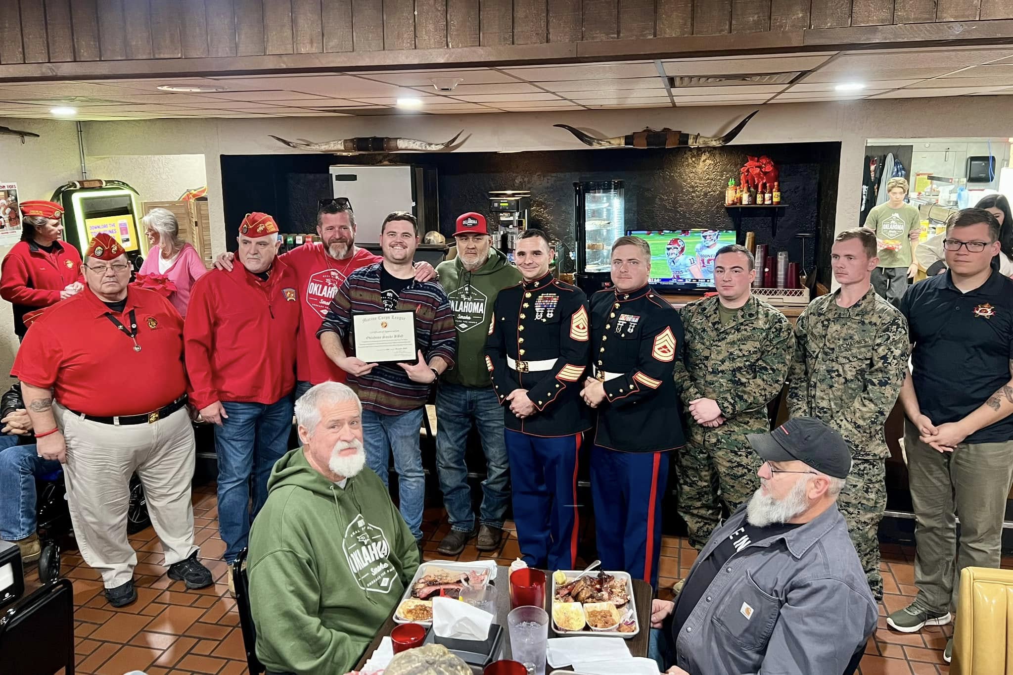 A group picture of bets with the Oklahoma smoke BBQ team.